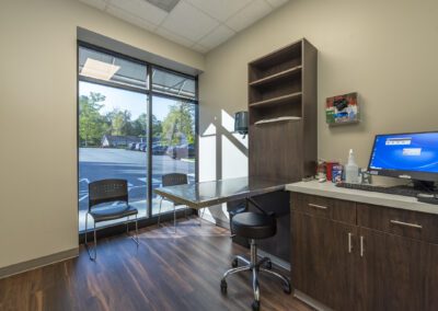 An office space with a desk and computer