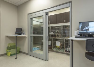 An interior view of a room with a desk and computer